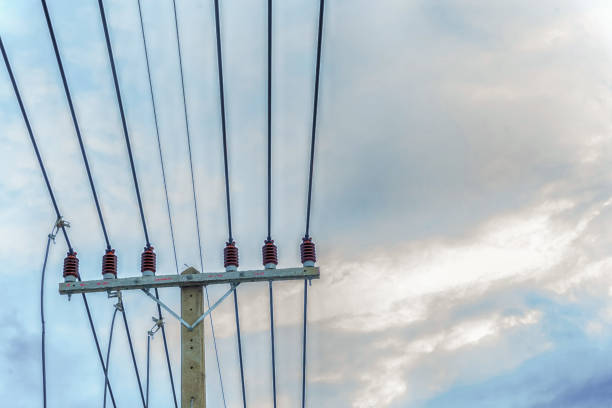 istock tensioned power lines attached to a pole against the sky 1197538580