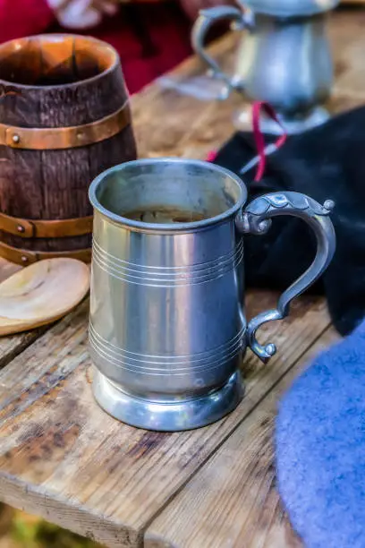 beer mug tin ceramic barrel close-up wooden table pub traditional dishes