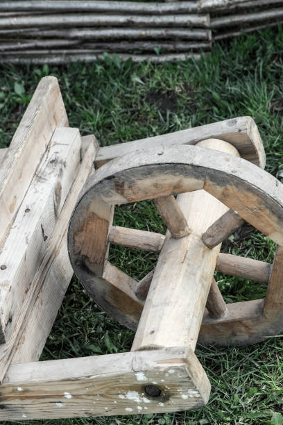 istock wooden wheelbarrow old work tool for delivering goods toned background close-up 1197539946