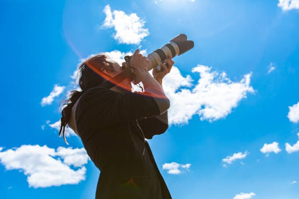istock Male photographer shooting the sky 1197542410