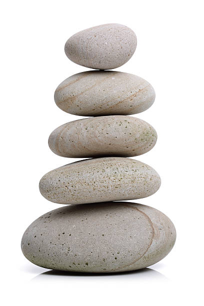 Stone balance Stack of white stones balancing isolated on white cairn stock pictures, royalty-free photos & images