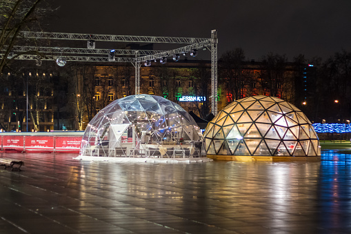 Vilnius, Lithuania - December 16, 2019: Transparent igloo is globe stall for Christmas holidays on the street of Vilnius in Lithuania