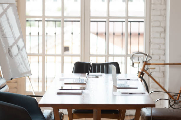 istock Up-to-date office boardroom interior with laptops on table 1197547352
