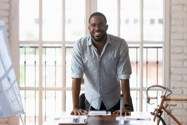 istock African businessman posing looking at camera near table in boardroom 1197547355