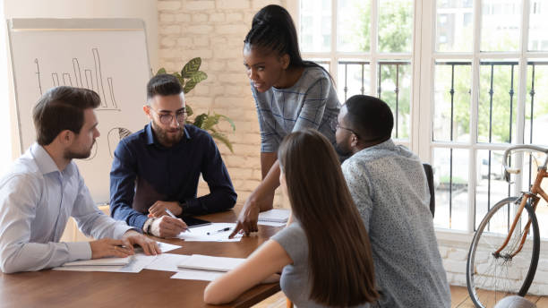 istock Team take part at group brainstorming lead by african boss 1197547402