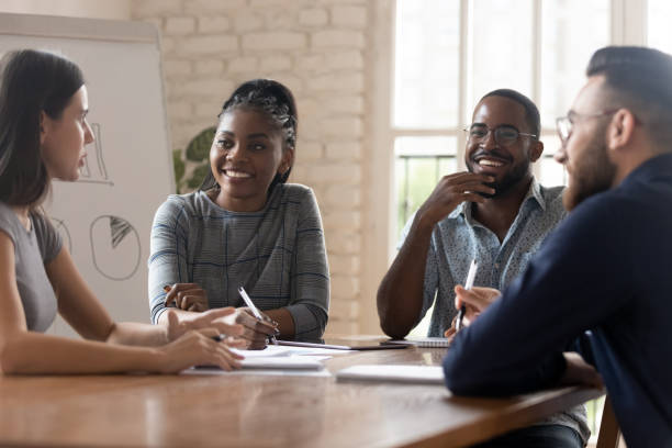 istock Multi racial employees listening ceo at group meeting 1197547410
