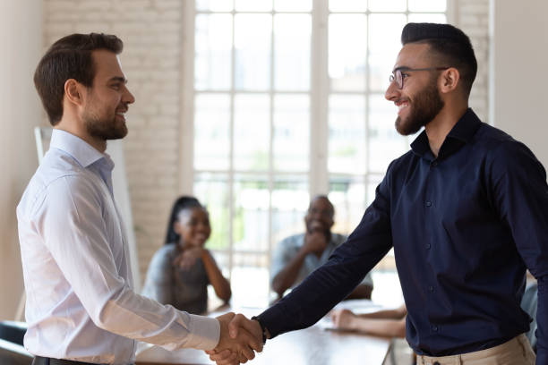 istock Caucasian and middle eastern ethnicity businessman handshaking greeting each other 1197547425