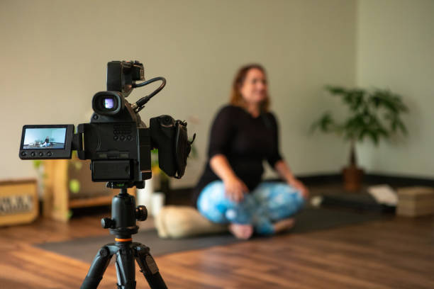 istock Yoga students attending professional yoga class 1197555200