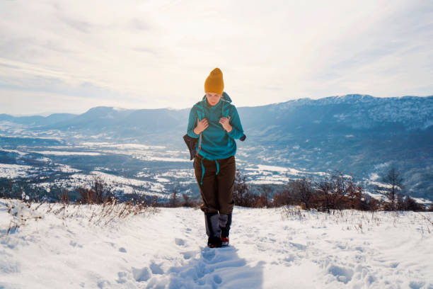 Young Caucasian woman on winter hiking.