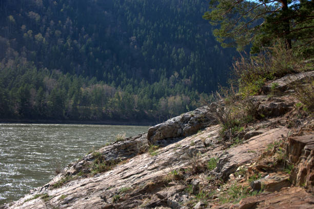 istock The flat rocky shore of a mountain river. 1197562792
