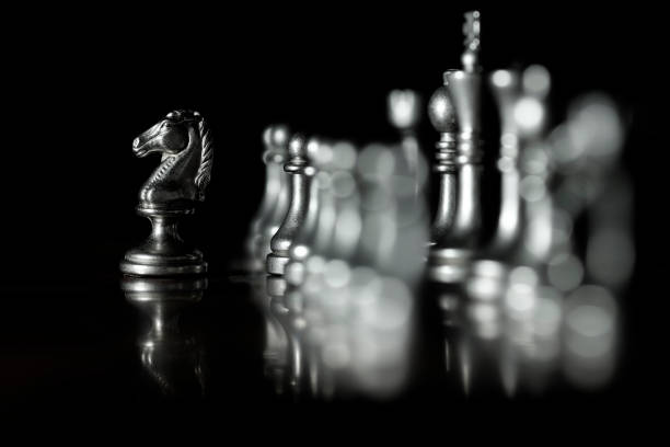 istock Pieces on chess board for playing game and strategy knight kingdom gaming 1197564027