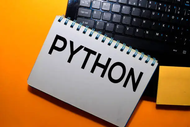python write on book with laptop keyboard background