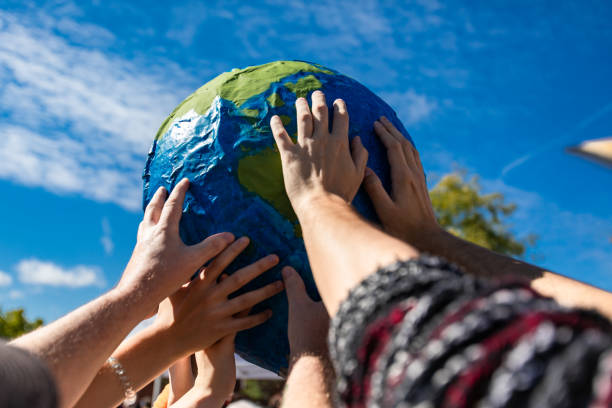 istock Close up of hands holding terra globe 1197569981