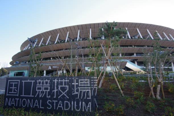New Japan National Stadium in Tokyo Tokyo, Japan - January 2, 2020 : view of the New National Stadium in Tokyo, Japan. The stadium will serve as the main stadium for the opening and closing ceremonies of the 2020 Olympics. The wood used is from all 47 prefectures in Japan.Total area: About 192,000㎡,Height: About 47m, Floor:5 floors above ground 2 2 floors below ground, Audience seats: About 60,000 seats olympic city stock pictures, royalty-free photos & images