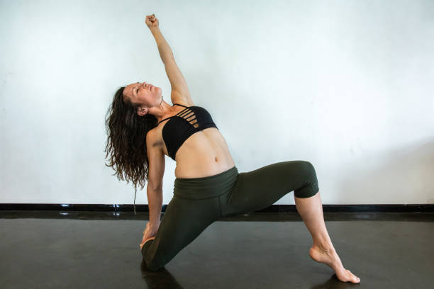 istock Healthy woman during flowing yoga class 1197576281