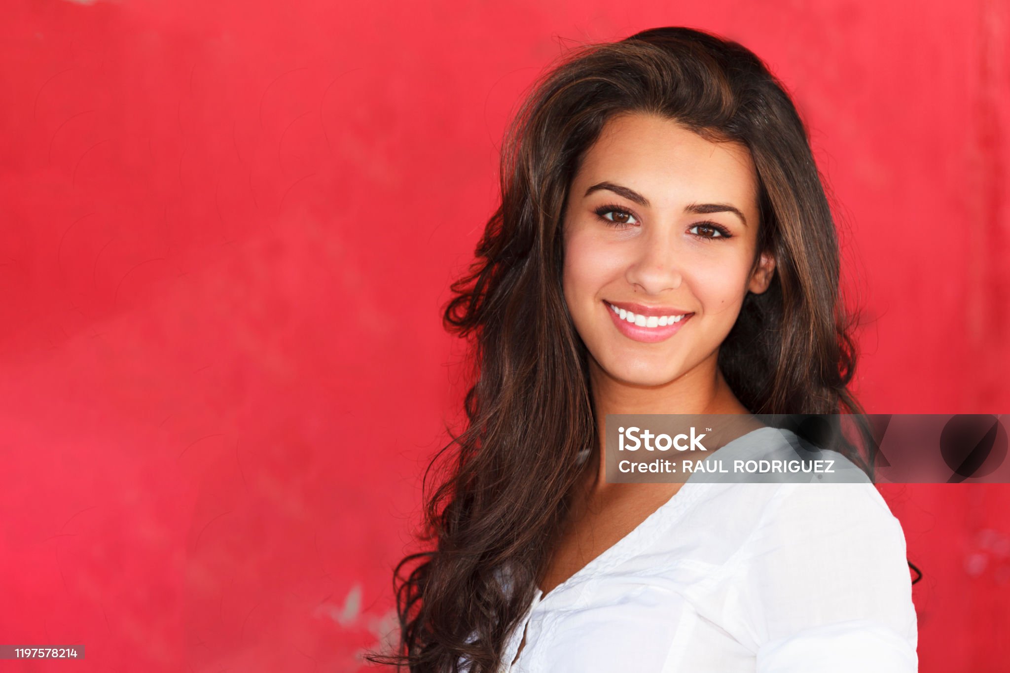 Brown long curly hair Latina woman