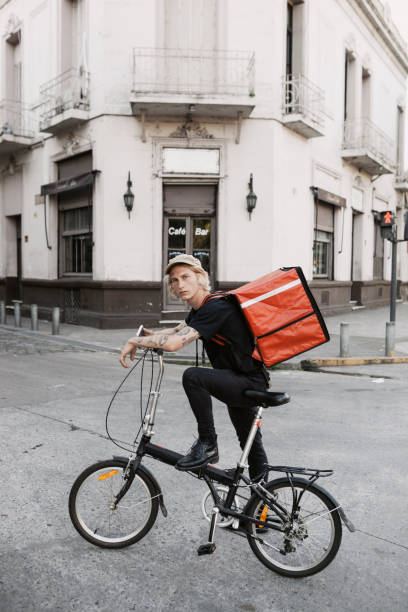 istock Food courier in front of a Restaurant 1197581706