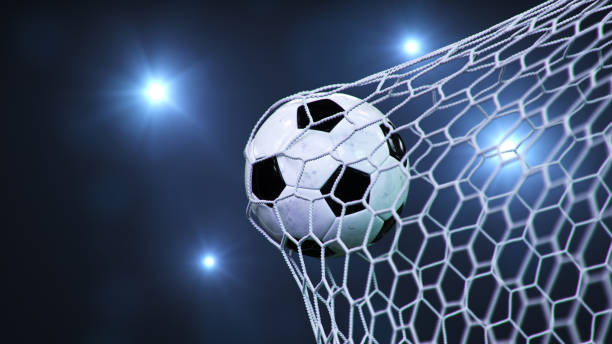 Soccer ball flew into the goal. Soccer ball bends the net, against the background of flashes of light. Soccer ball in goal net on blue background. A moment of delight. 3D illustration stock photo