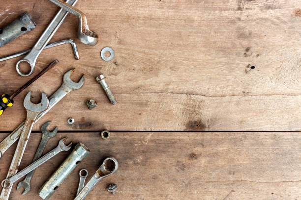 istock old tools on wooden floor background 1197586300