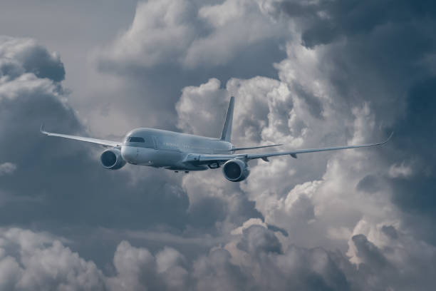 istock Passenger plane takes off from the stormy dark clouds. T 1197586302