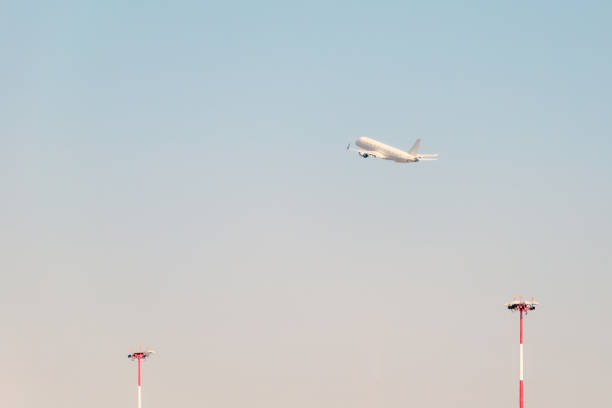 istock Plane is gaining altitude in the sky 1197586309