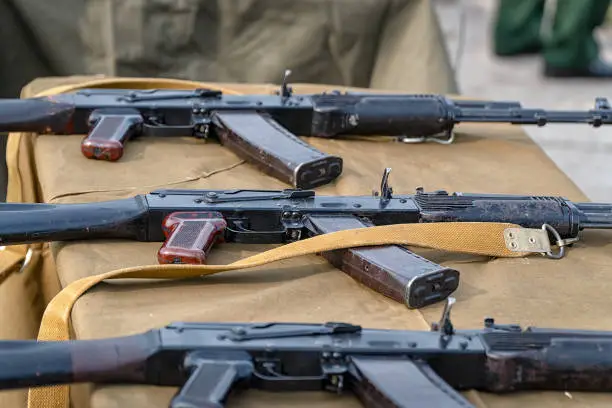 Kalashnikov assault rifles on the table. Russian weapon