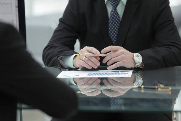 istock close up. businessman working with financial documents 1197588065