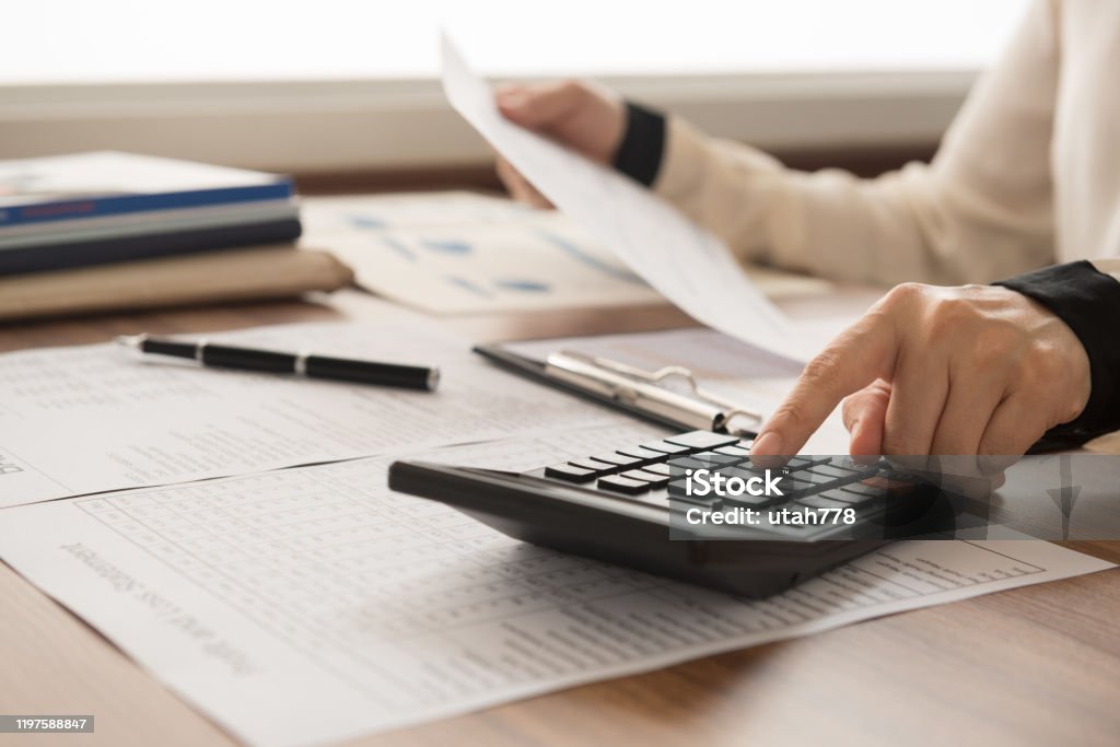 accountant financial bookkeeper inspector calculated and checking balance account. accounting and auditing concept. Finance Stock Photo