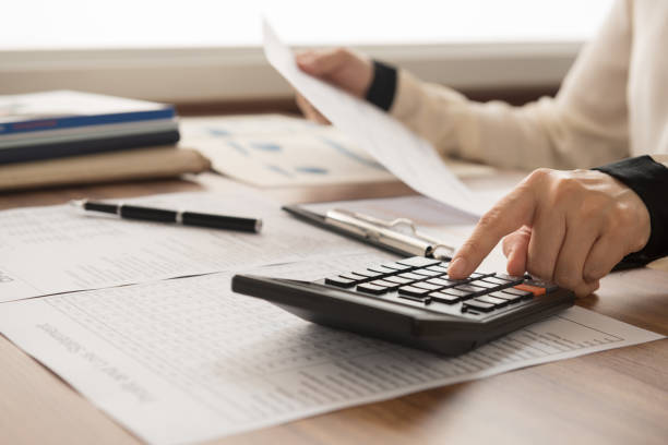 accountant financial bookkeeper inspector calculated and checking balance account. accounting and auditing concept. financial statement stock pictures, royalty-free photos & images