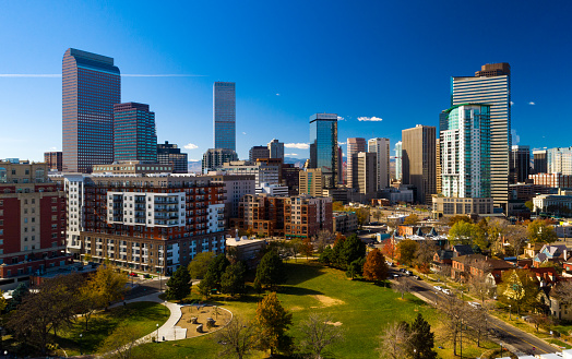Downtown Denver skyline aerial, wide angle view w/ Benedict Fountain Park in the foreground.
