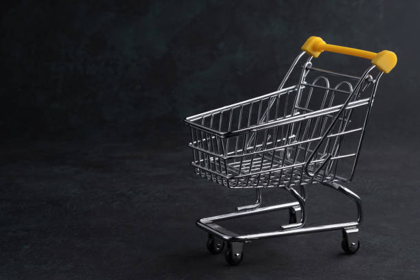 istock Turned pushcart empty on dark background, Black Friday concept. 1197591811