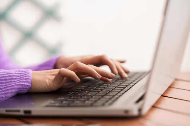 istock Persian woman on her balcony using laptop computer 1197593683