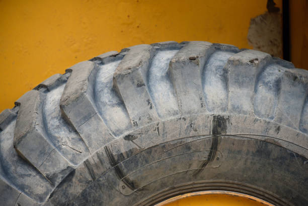 A set of dirty large truck tires with large tread