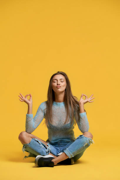 istock Front view of girl showing peace. 1197609029