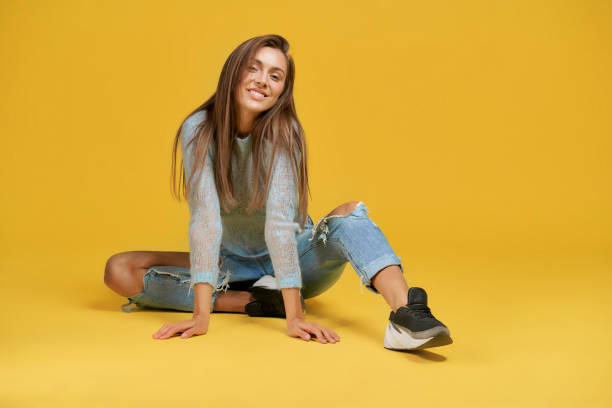 istock Front view of smiling girl on floor. 1197609046
