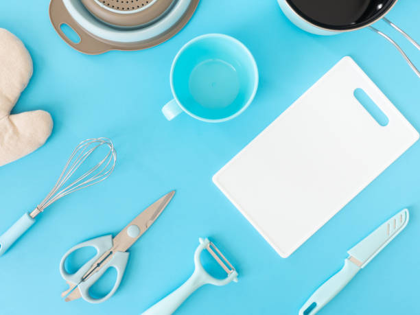istock top view of kitchen room concept with kitchenware on blue table background. 1197614622