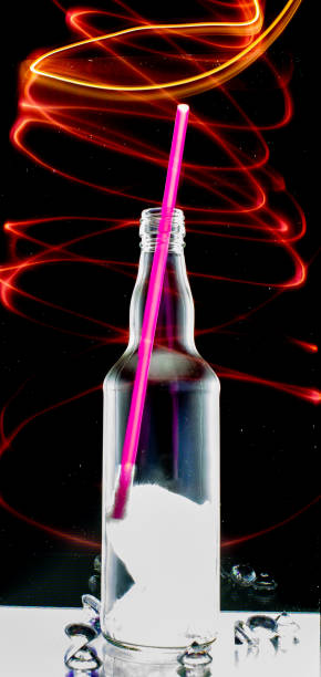 istock glass bottle in the foreground framed by light painting 1197615653