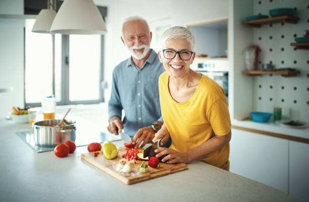 istock Mature couple cooking lunch together. 1197617634