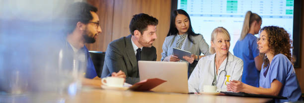 istock medical business meeting panoramic 1197620813