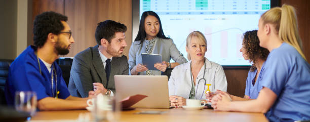 istock hospital business meeting panoramic 1197621901
