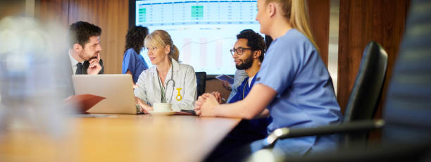 istock medical business discussion panoramic 1197621965