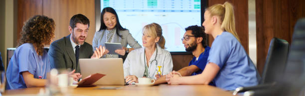 istock medical business discussion panoramic 1197622014