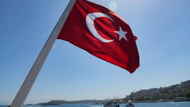 istock turkish flag flatters against ships sailing in sparkling sea 1197622162