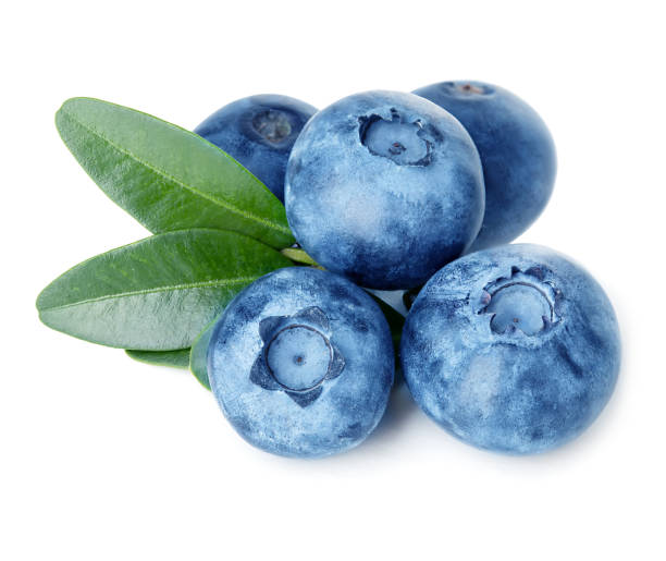 istock Blueberries with green leaves isolated on white background. 1197633539