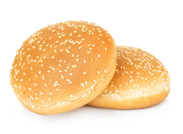 istock Two hamburger buns with sesame isolated on white background. 1197633545