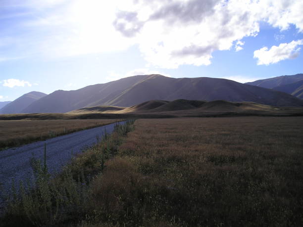 The Plains of Gondor April 21st, 2003, Twizel, Mackenzie District, Canterbury, New Zealand.  This is a picture taken across the plains Gondor (as they are featured in the film).  This plain is where the momentous battles of the book on the fields of Pelennor take place, between the forces of Good and Evil.  

It figures in J R R Tolkien's trilogy The Lord  of The Rings, specifically the third book The Return of The King.   This was taken on an overcast and very atmospheric day. mcdermp stock pictures, royalty-free photos & images