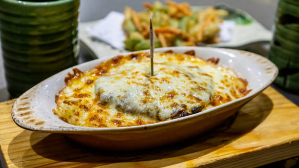 istock Baked Cheese Rice Serve Along with Kakiage and Tea 1197640390