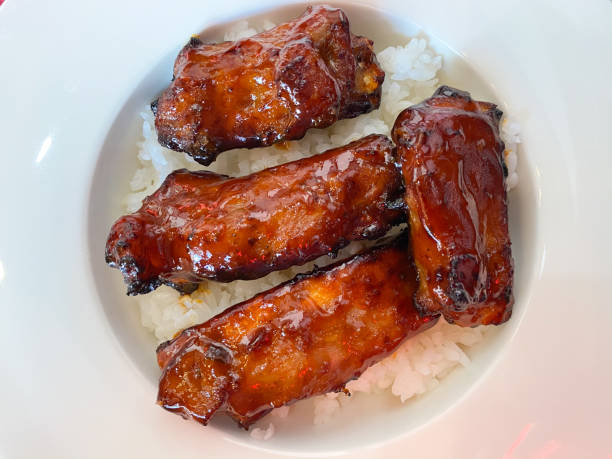 istock Pork rib with barbecue sauce served on rice in white dish 1197642212