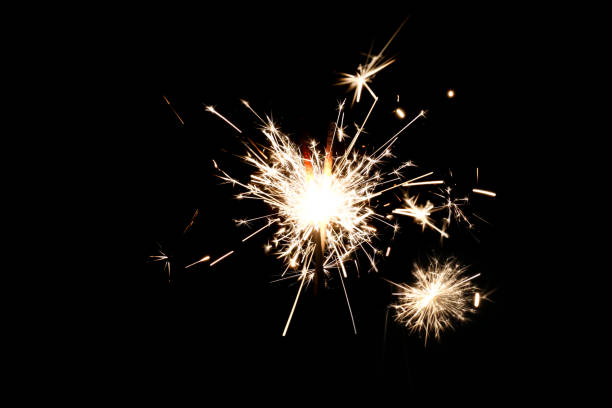 istock Burning sparkler isolated on black background 1197643481