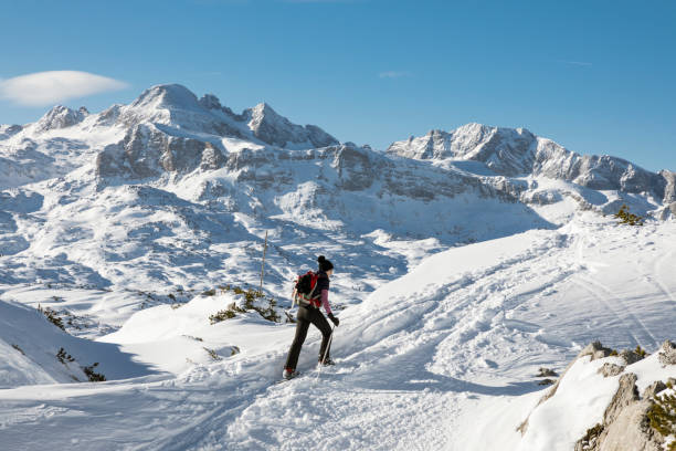 istock Uphill snowshoeing on marked track in the Dachstein Mountains, Austria. 1197646009
